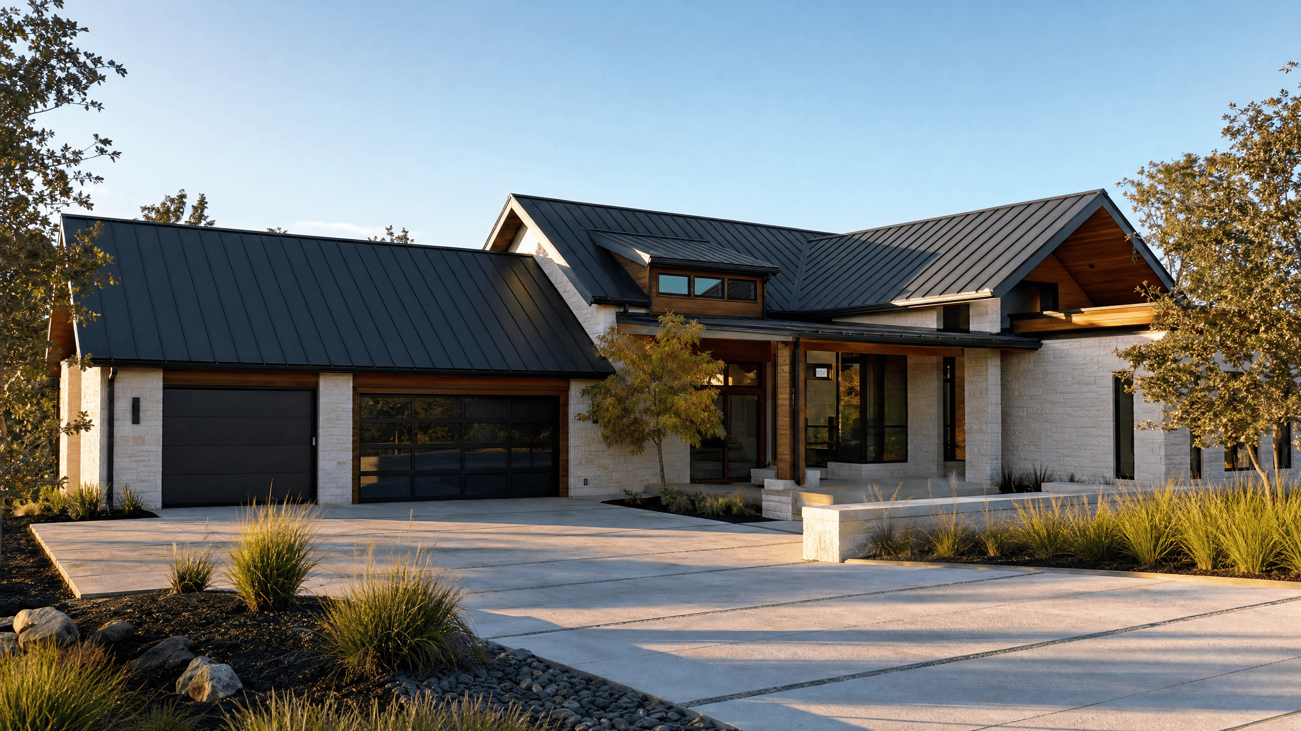 Modern home featuring a standing-seam metal roof and premium exterior finishes installed by Quest Exteriors